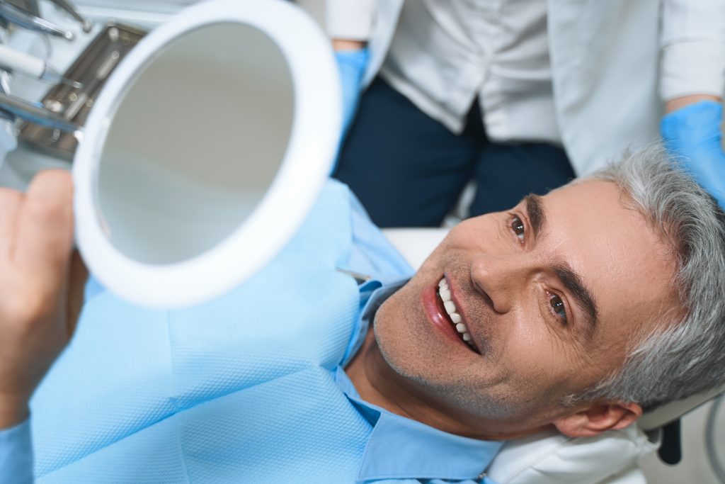 dental bridge vs implant
